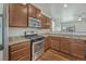 Modern kitchen with stainless steel appliances, wood floors, and granite countertops at 42396 Glen Abbey Dr, Elizabeth, CO 80107