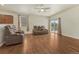 Spacious living room with ceiling fan and sliding glass doors for natural light at 42396 Glen Abbey Dr, Elizabeth, CO 80107