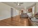 Bright living area with hardwood floors, ceiling fan, and neutral paint at 42396 Glen Abbey Dr, Elizabeth, CO 80107