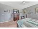 Main bedroom featuring a large TV, comfortable seating, and ample closet space at 42396 Glen Abbey Dr, Elizabeth, CO 80107