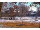 Large backyard with a swing set and snowy landscape at 1150 W Caley Ave, Littleton, CO 80120