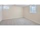 Finished basement room with gray carpeting and window at 1150 W Caley Ave, Littleton, CO 80120