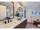 Elegant bathroom with double vanity and modern fixtures at 1150 W Caley Ave, Littleton, CO 80120