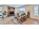 Living area with stone fireplace and ample natural light at 1150 W Caley Ave, Littleton, CO 80120