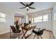 Charming office featuring a modern ceiling fan, hardwood floors, a cowhide rug and stylish décor at 1150 W Caley Ave, Littleton, CO 80120