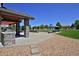 Outdoor patio with stone kitchen, pool, landscaped yard, and play area at 1315 W 141St Cir, Westminster, CO 80023
