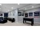 Finished basement features a shuffleboard table, foosball table, and comfortable seating area at 1315 W 141St Cir, Westminster, CO 80023