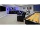 Finished basement featuring a bar, lounge chairs, electric drums, and shuffleboard table at 1315 W 141St Cir, Westminster, CO 80023