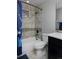 Bathroom features a shower-tub combo with a tiled surround and modern fixtures at 1315 W 141St Cir, Westminster, CO 80023