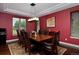 Dining room featuring a coffered ceiling, hardwood floors, and a modern chandelier at 1315 W 141St Cir, Westminster, CO 80023