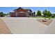 Exterior view of home with stone accents, three-car garage, and landscaped driveway at 1315 W 141St Cir, Westminster, CO 80023
