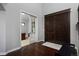 Foyer with wood flooring, dark wood doors, and a view into the office at 1315 W 141St Cir, Westminster, CO 80023