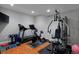 Home gym featuring a treadmill, stationary bike, and a multi-station weight machine at 1315 W 141St Cir, Westminster, CO 80023
