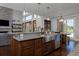 Gourmet kitchen with a large island, stainless steel appliances, and hardwood floors at 1315 W 141St Cir, Westminster, CO 80023