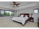 Bright bedroom features large window, neutral tones and ceiling fan at 1315 W 141St Cir, Westminster, CO 80023