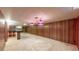 Spacious finished basement featuring a bar and unique lighting fixtures at 2300 Joliet St, Aurora, CO 80010