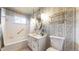 Charming bathroom with floral wallpaper, vanity, and shower-tub combo at 2300 Joliet St, Aurora, CO 80010