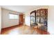 Hardwood bedroom with a charming mural wall and bright natural light at 2300 Joliet St, Aurora, CO 80010