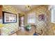 Sunny breakfast nook featuring floral wallpaper and natural light at 2300 Joliet St, Aurora, CO 80010