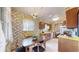 Vintage eat-in kitchen featuring floral wallpaper and retro light fixture at 2300 Joliet St, Aurora, CO 80010