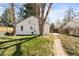 Backyard with brick pathway and white building at 309 S Hudson St, Denver, CO 80246