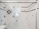 Tile shower with glass doors and decorative accents at 309 S Hudson St, Denver, CO 80246
