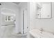 Bathroom sink and mirror with an open doorway to living space at 309 S Hudson St, Denver, CO 80246