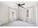 Bedroom with two windows, ceiling fan, and white walls at 309 S Hudson St, Denver, CO 80246