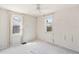 A bright bedroom with two windows and a ceiling fan at 309 S Hudson St, Denver, CO 80246
