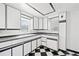 Clean kitchen featuring white cabinets, contrasting trim, and a checkerboard floor at 309 S Hudson St, Denver, CO 80246