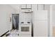 The kitchen includes a stove, refrigerator, and access to the backyard at 309 S Hudson St, Denver, CO 80246