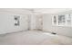 Bright living room featuring multiple windows and neutral walls at 309 S Hudson St, Denver, CO 80246