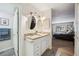 Clean bathroom with updated vanity and a large mirror at 14102 E Linvale Pl # 106, Aurora, CO 80014