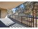 Private patio with treetop views and a wood fence at 14102 E Linvale Pl # 106, Aurora, CO 80014