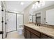 Bathroom vanity with granite countertop and walk-in shower at 23539 E Ida Dr # C, Aurora, CO 80016