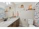 Bathroom with granite countertops, modern fixtures, and a colorful shower curtain at 23539 E Ida Dr # C, Aurora, CO 80016