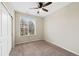 Bedroom with window and neutral carpet at 23539 E Ida Dr # C, Aurora, CO 80016