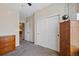 Bedroom features neutral walls, closet with sliding doors and natural light at 23539 E Ida Dr # C, Aurora, CO 80016