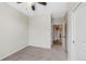 Neutral bedroom features modern ceiling fan and access to additional rooms at 23539 E Ida Dr # C, Aurora, CO 80016