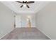 Bedroom with tray ceiling, ceiling fan, and en suite bath at 23539 E Ida Dr # C, Aurora, CO 80016