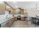 Modern kitchen boasts sleek countertops, stainless steel appliances, and wood-look flooring for a contemporary feel at 23539 E Ida Dr # C, Aurora, CO 80016