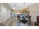 Well-lit kitchen features stainless steel appliances, a stylish breakfast table, and wood-look floors, perfect for modern living at 23539 E Ida Dr # C, Aurora, CO 80016