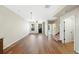 Open-concept living room features a ceiling fan, wood floors and large windows at 23539 E Ida Dr # C, Aurora, CO 80016