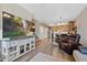 Open-concept living space with wood floors, kitchen, dining area and comfortable seating at 23539 E Ida Dr # C, Aurora, CO 80016