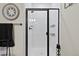 Modern walk-in shower features sleek black trim, white tile, and wall-mounted storage baskets at 23539 E Ida Dr # C, Aurora, CO 80016