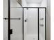 Modern shower features sleek black fixtures and bright white subway tile at 23539 E Ida Dr # C, Aurora, CO 80016