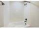 Clean and sleek shower with bright white tiling, modern fixtures, and a relaxing showerhead, ready for use at 23539 E Ida Dr # C, Aurora, CO 80016