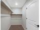 Bright walk-in closet offers ample storage with shelving and rod, creating an organized and efficient space at 23539 E Ida Dr # C, Aurora, CO 80016