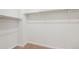 Empty walk-in closet with built in closet rods at 23539 E Ida Dr # C, Aurora, CO 80016
