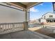 View from the porch with decorative brick columns and white railings at 24811 E 33Rd Dr, Aurora, CO 80019